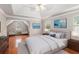 Inviting main bedroom with hardwood floors, tray ceiling, and sitting area at 2320 Crystal Ct, Loganville, GA 30052