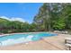 Community pool with lounge chairs and landscaped area perfect for a relaxing afternoon at 2320 Crystal Ct, Loganville, GA 30052