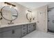 Bright bathroom featuring a dual vanity with modern fixtures and a glass enclosed shower at 235 Holly Nw Rd, Atlanta, GA 30314
