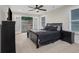 Primary bedroom with french doors leading to outdoor area and dark wood furniture at 235 Holly Nw Rd, Atlanta, GA 30314