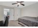 Bedroom featuring neutral walls, ceiling fan and view of a dinette set through an open doorway at 235 Holly Nw Rd, Atlanta, GA 30314