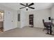Bedroom with a ceiling fan, two doors and a desk with computer monitor at 235 Holly Nw Rd, Atlanta, GA 30314