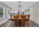 Dining area with a view of kitchen including stainless appliances and white cabinets at 235 Holly Nw Rd, Atlanta, GA 30314