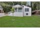 Charming two-story home with landscaped yard and covered front porch; a welcoming facade at 235 Holly Nw Rd, Atlanta, GA 30314