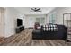 Cozy living space with sleek floors, a sectional sofa, and large windows providing abundant light at 235 Holly Nw Rd, Atlanta, GA 30314