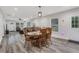 Well-lit open concept living space with seating, a dining area and lots of natural light at 235 Holly Nw Rd, Atlanta, GA 30314
