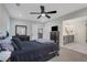 This main bedroom features a glimpse into the ensuite bathroom with white tiling at 235 Holly Nw Rd, Atlanta, GA 30314