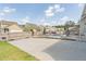 Spacious backyard with pool, patio, and driveway, offering ample space for outdoor activities and entertaining at 408 Blue Sky Cir, Acworth, GA 30102