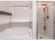 Bright bathroom featuring a soaking tub and glass enclosed shower at 408 Blue Sky Cir, Acworth, GA 30102