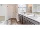 Bathroom with dual sink vanity, attractive lighting, and large shower at 408 Blue Sky Cir, Acworth, GA 30102