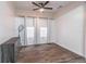 Bright bedroom featuring two windows with wood-look floors at 408 Blue Sky Cir, Acworth, GA 30102
