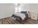 Cozy bedroom featuring hardwood floors, natural light, and neutral decor at 408 Blue Sky Cir, Acworth, GA 30102