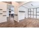 Bright dining room showcasing wood floors, wainscoting, and modern light fixtures at 408 Blue Sky Cir, Acworth, GA 30102