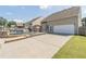 Long driveway leading to a backyard with a pool, patio, and outdoor entertainment area, enhancing the property's appeal at 408 Blue Sky Cir, Acworth, GA 30102