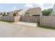 Backyard driveway with a fenced gate and access to the house and pool area at 408 Blue Sky Cir, Acworth, GA 30102