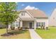 Charming two-story home with landscaped yard, covered porch, and neutral siding on a sunny day at 408 Blue Sky Cir, Acworth, GA 30102
