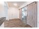 Elegant foyer with wood floors, barn door, and neutral palette creates a welcoming entrance at 408 Blue Sky Cir, Acworth, GA 30102