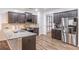 Stylish kitchen with stainless appliances, granite countertops, and dark wood cabinets for a modern feel at 408 Blue Sky Cir, Acworth, GA 30102