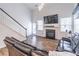 Open living room with fireplace, staircase, and abundant natural light at 408 Blue Sky Cir, Acworth, GA 30102