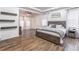 Spacious main bedroom features wood floors, tray ceiling, and abundant natural light at 408 Blue Sky Cir, Acworth, GA 30102