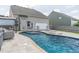 Backyard pool with spa, patio, lounge chairs, and outdoor seating area adjacent to the house at 408 Blue Sky Cir, Acworth, GA 30102