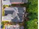 Aerial view showcasing the roof, deck, and lush landscaping surrounding the home at 4569 Fountain Ne Dr, Marietta, GA 30067