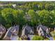 Aerial view of beautiful homes nestled in a lush, green, and wooded community at 4569 Fountain Ne Dr, Marietta, GA 30067