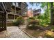 Multi-level deck and screened porch overlooking landscaped backyard with stone and pebble accents at 4569 Fountain Ne Dr, Marietta, GA 30067