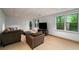 Finished basement with cozy seating, natural light, and tile flooring at 4569 Fountain Ne Dr, Marietta, GA 30067