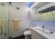 A modern bathroom featuring unique textured tiles, sleek fixtures, and a glass-enclosed shower at 4569 Fountain Ne Dr, Marietta, GA 30067