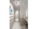 Bright bathroom featuring marble tile and glass shower with a modern, minimalist aesthetic at 4569 Fountain Ne Dr, Marietta, GA 30067
