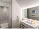 Contemporary bathroom featuring a sleek vanity, large mirror, and a glass-enclosed shower at 4569 Fountain Ne Dr, Marietta, GA 30067