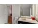 Modern bathroom with sink and a brightly lit mirror, next to the doorway at 4569 Fountain Ne Dr, Marietta, GA 30067