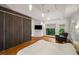 Bright bedroom with a large window, hardwood floors, and a spacious closet at 4569 Fountain Ne Dr, Marietta, GA 30067