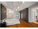 Spacious bedroom featuring a tray ceiling, and hardwood floors at 4569 Fountain Ne Dr, Marietta, GA 30067