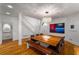 Bright dining area with hardwood flooring, modern chandelier, and an adjacent staircase at 4569 Fountain Ne Dr, Marietta, GA 30067