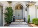 Elegant double front doors framed by stone steps, stylish planters and a welcoming archway entrance at 4569 Fountain Ne Dr, Marietta, GA 30067