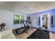 Modern home gym featuring a treadmill, fitness equipment, and bright lighting at 4569 Fountain Ne Dr, Marietta, GA 30067