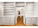 Hallway with hardwood floors, built-in shelving, and neutral paint at 4569 Fountain Ne Dr, Marietta, GA 30067