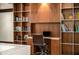 Home office featuring hardwood floor, built in wood shelving, and deskspace at 4569 Fountain Ne Dr, Marietta, GA 30067