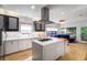 Modern kitchen boasting white cabinets, a center island with cooktop, and an open layout at 4569 Fountain Ne Dr, Marietta, GA 30067