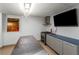 Finished basement kitchenette featuring stainless steel appliances and blue cabinets, perfect for entertaining at 4569 Fountain Ne Dr, Marietta, GA 30067