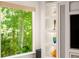 Bright living space showcasing large windows and custom built-in shelving at 4569 Fountain Ne Dr, Marietta, GA 30067