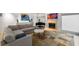 Cozy living room featuring a gray sectional sofa, a fireplace, and stylish artwork at 4569 Fountain Ne Dr, Marietta, GA 30067