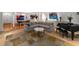 Open-concept living room featuring a sectional sofa, piano, and a view of the dining and kitchen areas at 4569 Fountain Ne Dr, Marietta, GA 30067