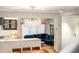View of a living space and a dining area showcasing contemporary lighting and a comfortable blue sofa at 4569 Fountain Ne Dr, Marietta, GA 30067