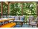 Comfortable outdoor seating area on a screened-in porch, perfect for relaxation at 4569 Fountain Ne Dr, Marietta, GA 30067