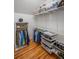 Organized walk-in closet with shelving, drawers, and ample storage space for clothes and accessories at 4569 Fountain Ne Dr, Marietta, GA 30067