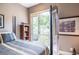 Cozy bedroom with balcony access featuring a metal railing and lush, green views at 1100 Parker Ne Pl, Atlanta, GA 30324