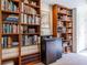 Detailed view of the built-in bookcase featuring a mini-fridge and abundant shelving at 1100 Parker Ne Pl, Atlanta, GA 30324